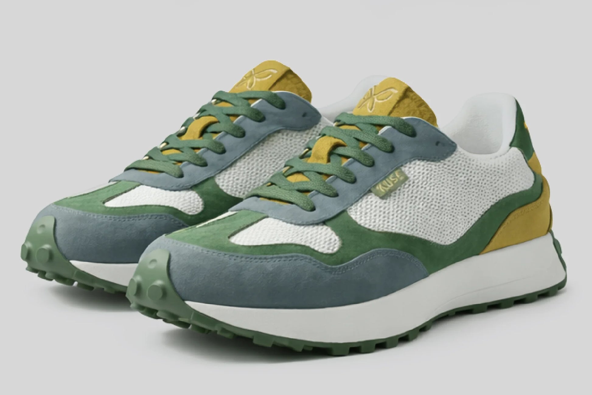 Zapatillas casual unisex Kuse verde azul mostaza en perspectiva 3D con suela gruesa y acabados en ante